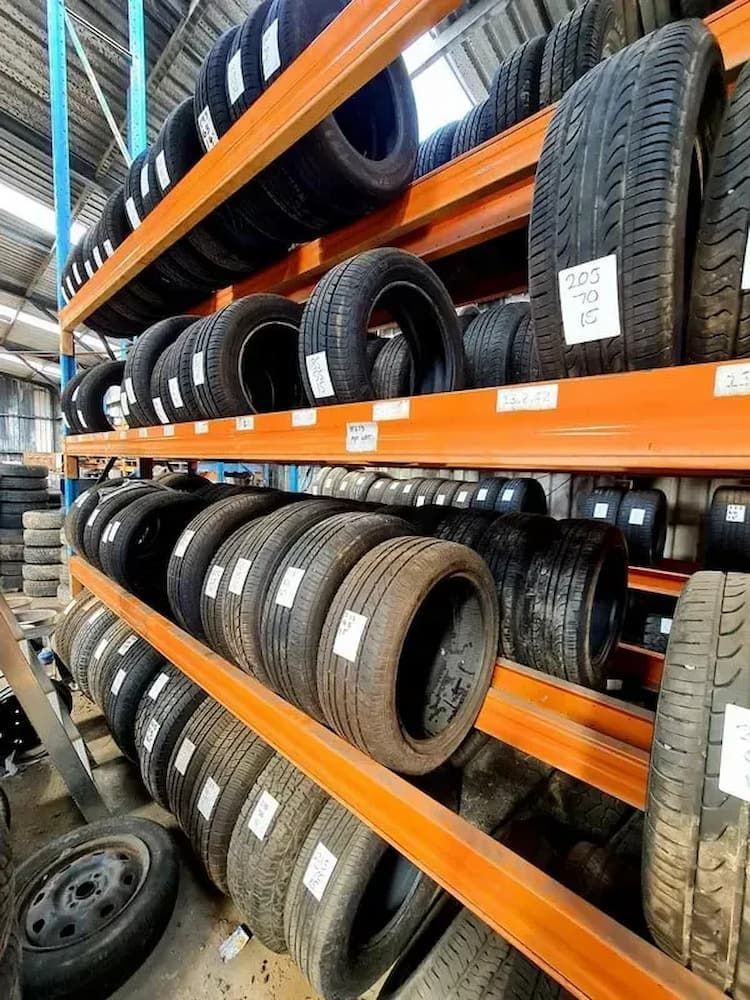 A Warehouse Filled With Lots of Tires and Wheels — Bago Auto Dismantlers in Bonny Hills, NSW
