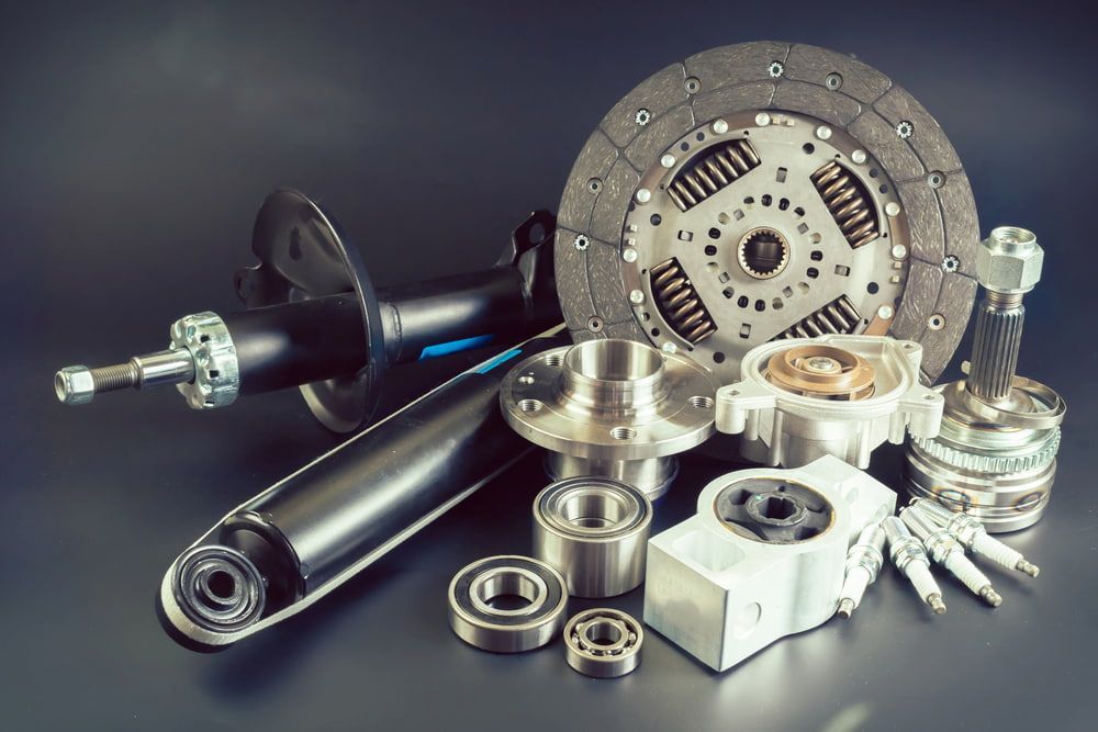 A Bunch of Car Parts Are Sitting on a Table — Bago Auto Dismantlers in Kempsey, NSW