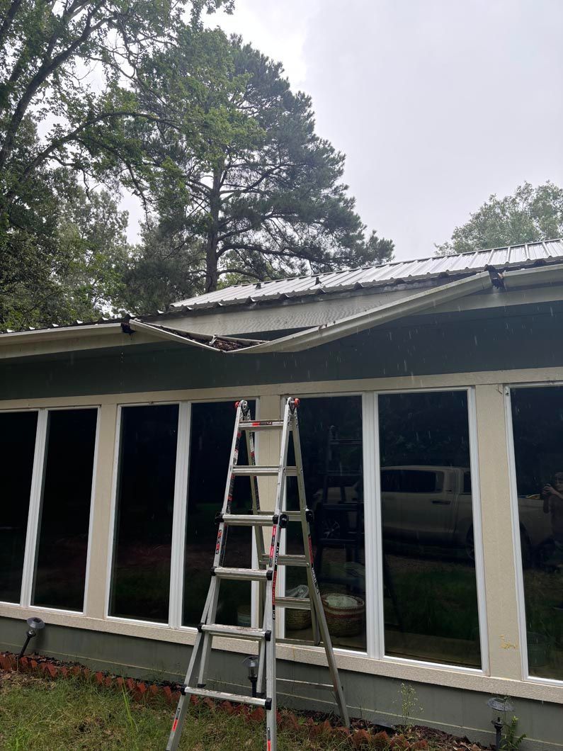 A ladder is leaning against the side of a house.