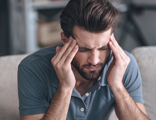 Man Experiencing Migraine — Rose Hill, KS — Rose Hill Chiropractic
