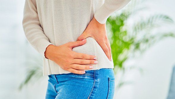 Woman Experiencing Hip Pain — Rose Hill, KS — Rose Hill Chiropractic