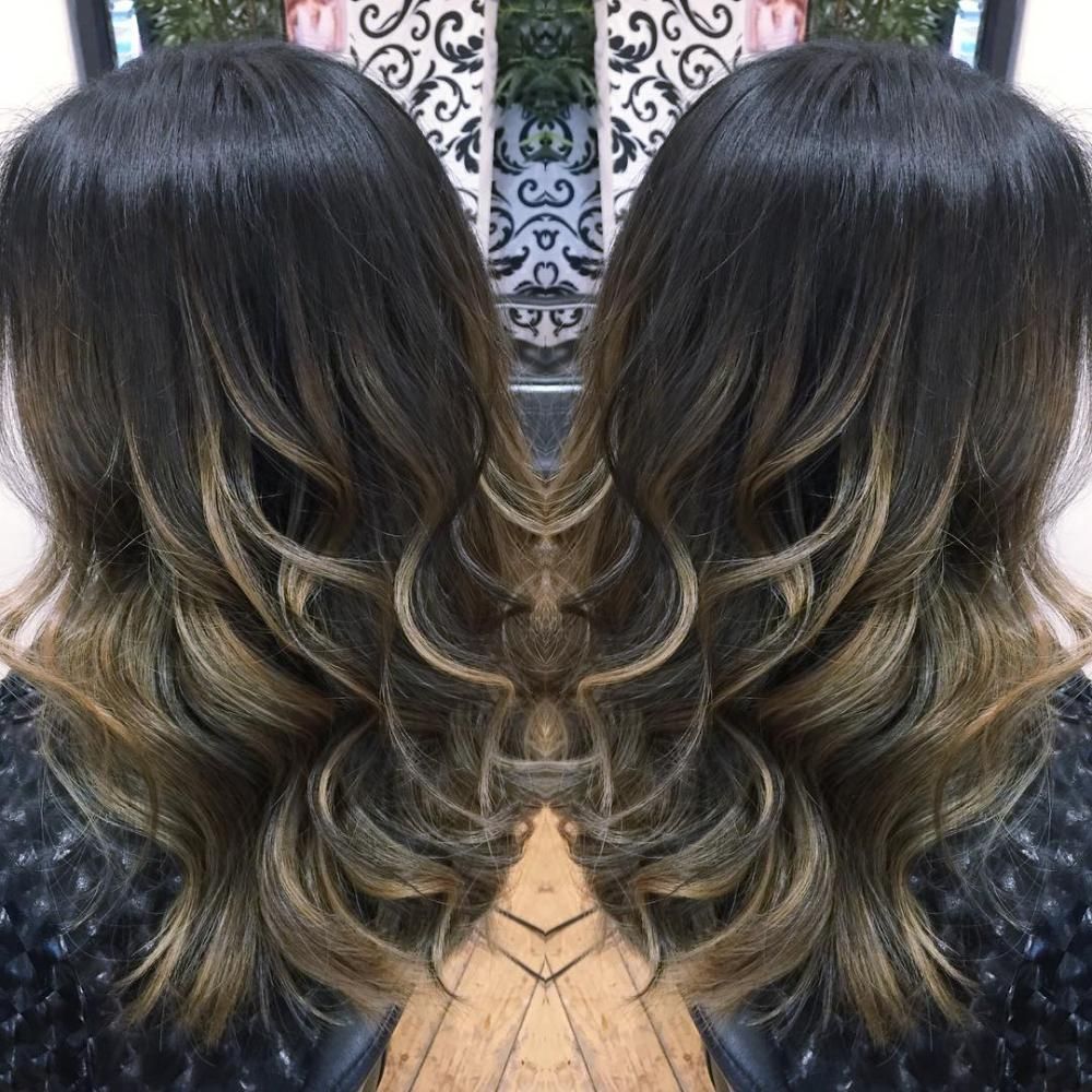 A Womans Hair is Reflected in a Mirror — Choo Choo Hair and Beauty In Wyong, NSW