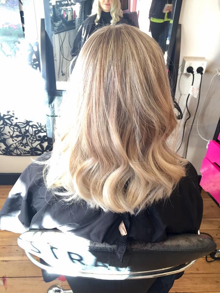 Woman's Wavy, Blonde Hair Styled in a Salon, Viewed From the Back — Elysian Salon In Charmhaven, NSW