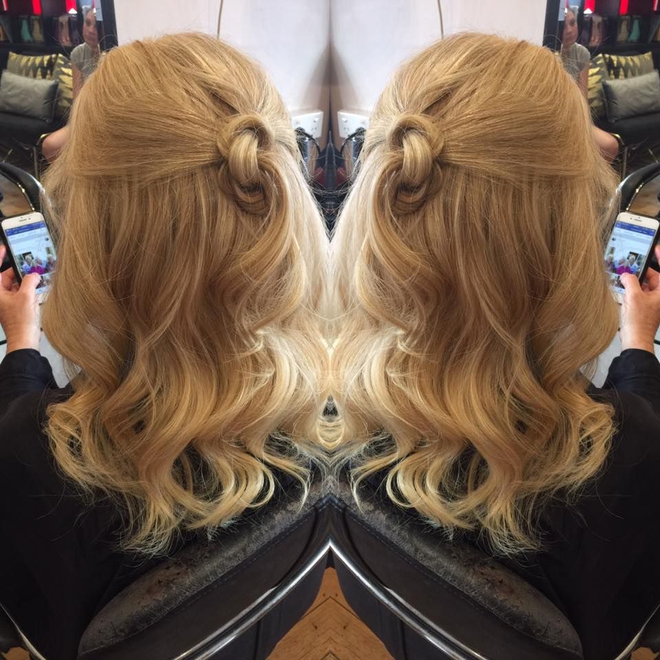 Blonde Wavy Hair Styled With a Knot on the Upper Back — Elysian Salon In Berkeley Vale, NSW