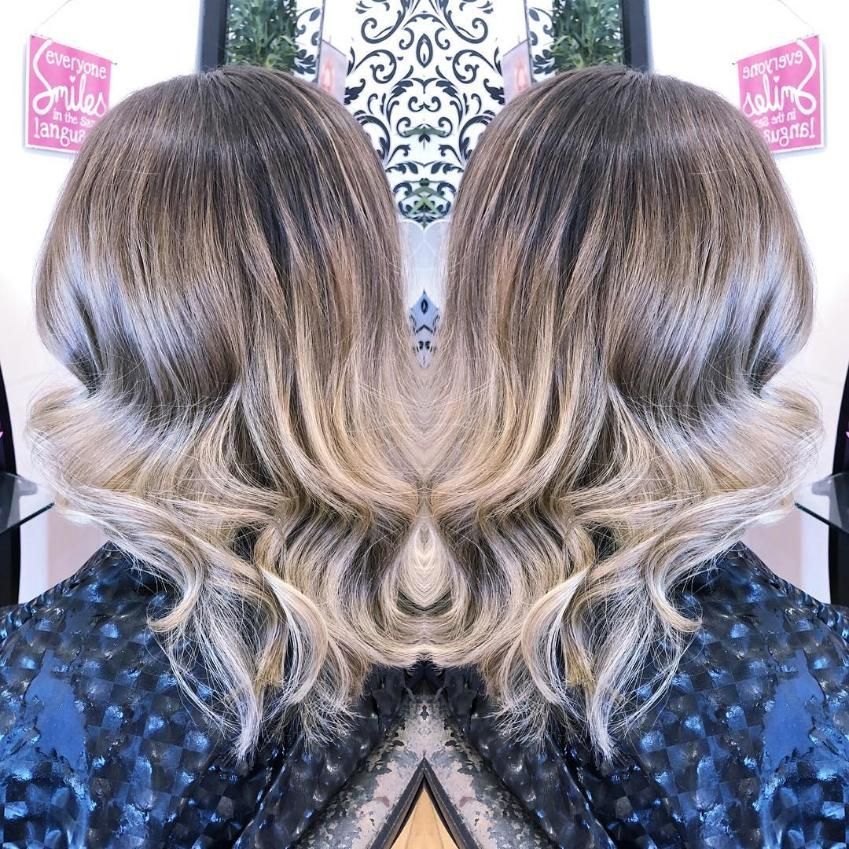 A Womans Hair is Reflected in a Mirror — Choo Choo Hair and Beauty In Wyong, NSW
