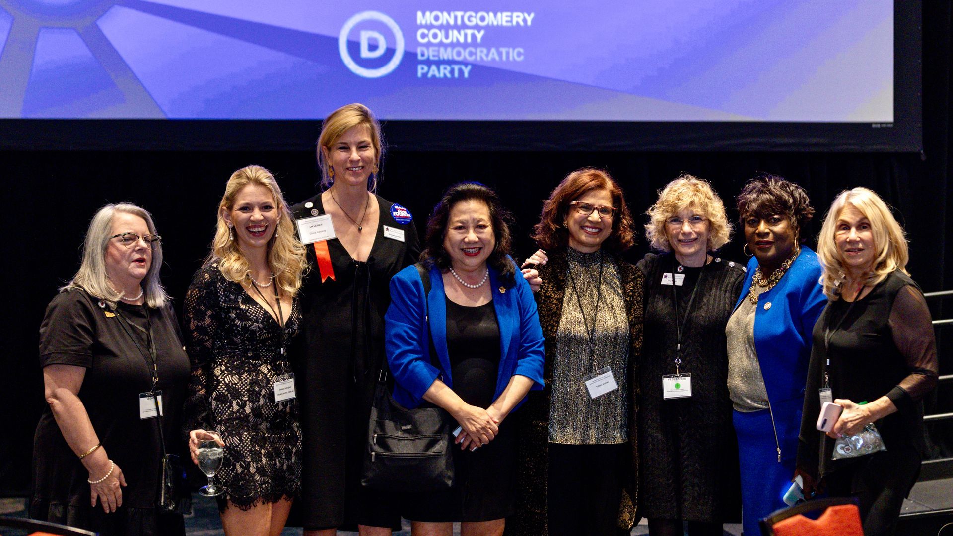 Group of WDC members at a Montgomery County Democratic Party event, posing for a photo.