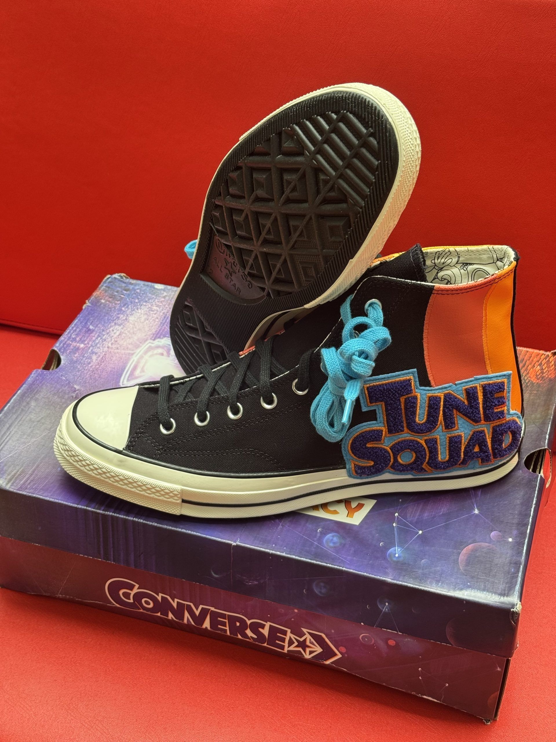 Black Converse Tune Squad sneakers on a box, with a blue Bugs Bunny embellishment.