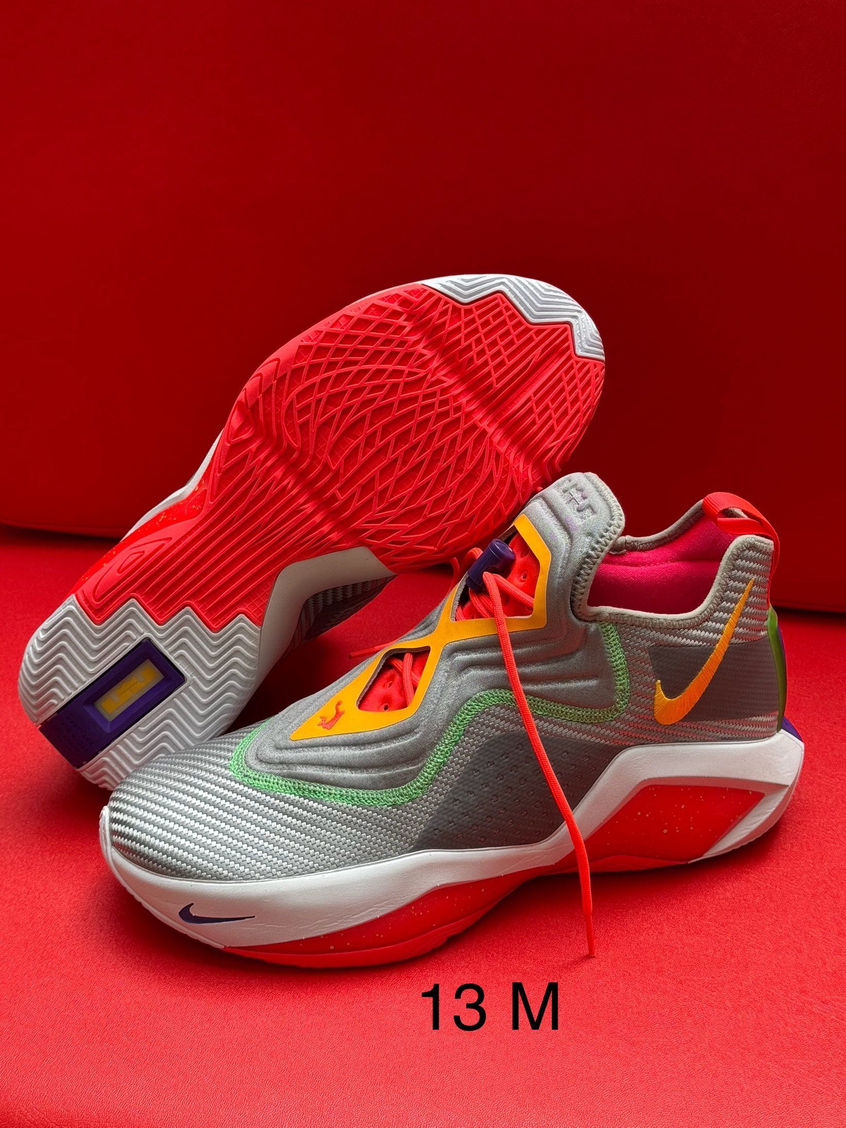 Gray, orange, and red athletic shoes. 