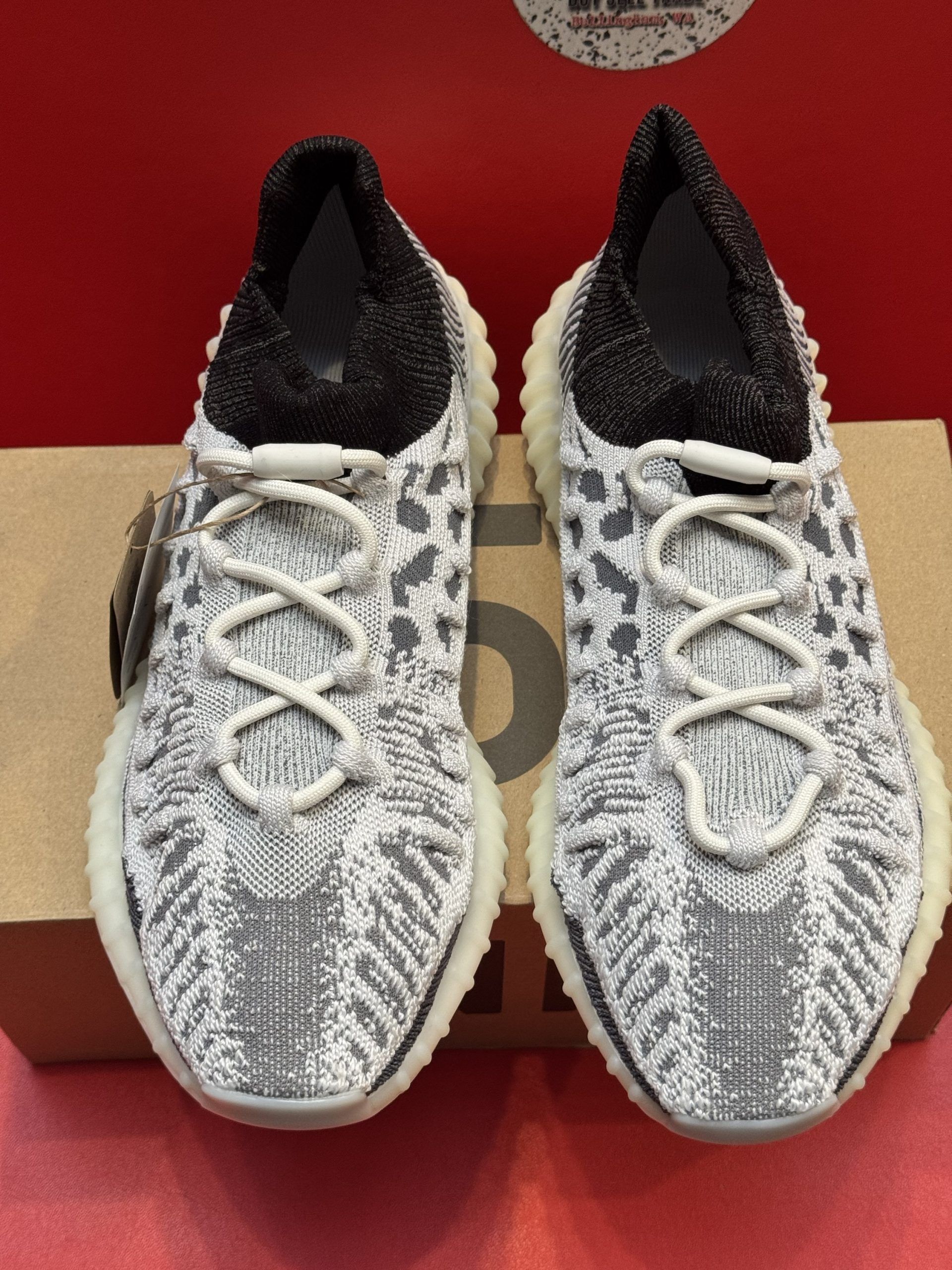 Yeezy Boost 350 V2 sneakers on top of a 