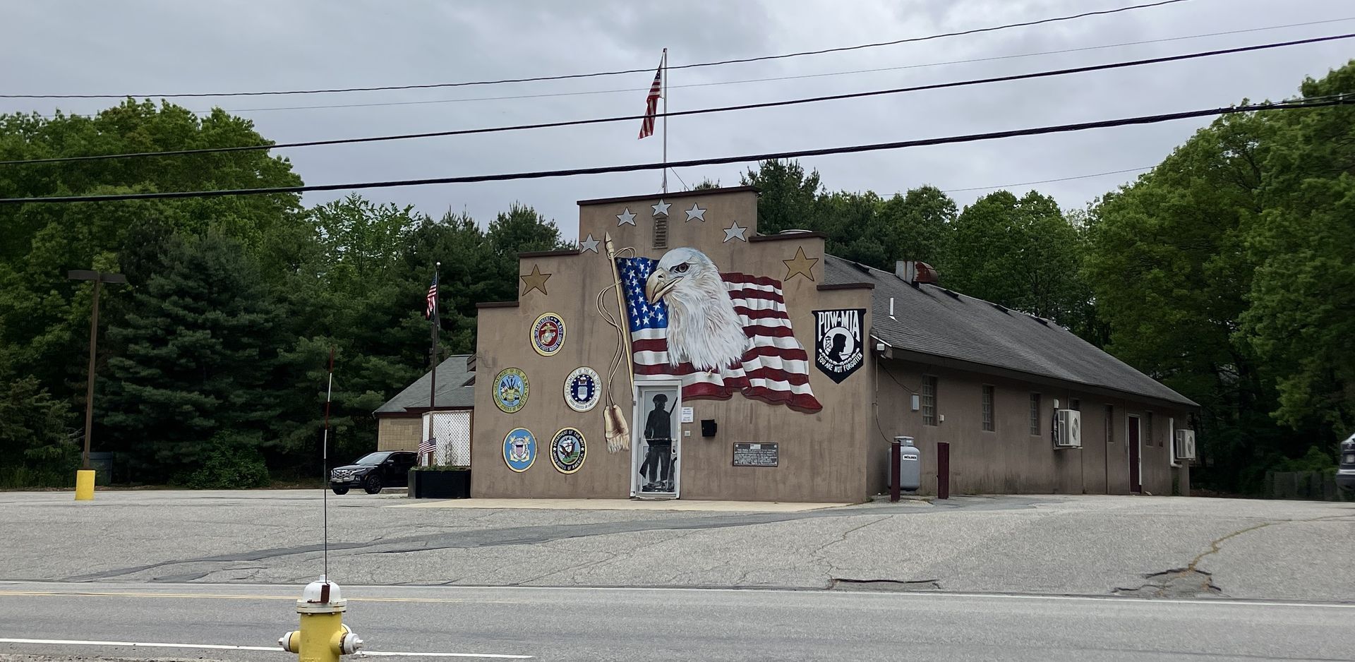 A building with a fire hydrant in front of it
