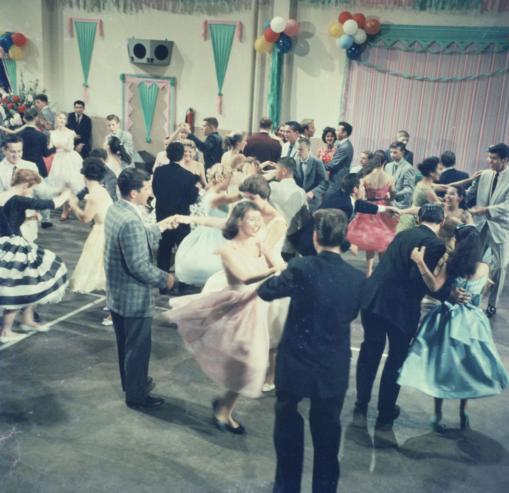 A group of people are standing next to each other at a party.