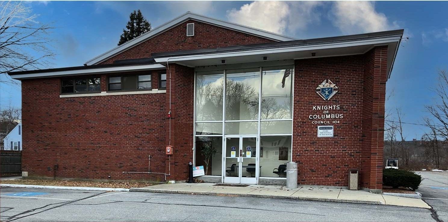 A brick building with a heart on the front of it