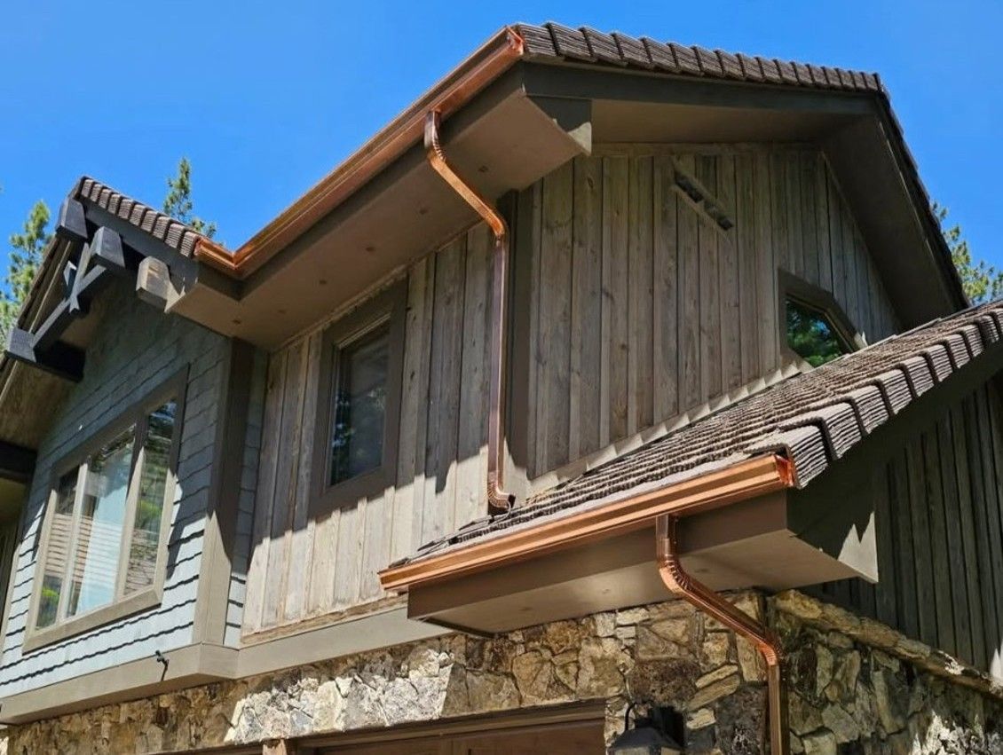 New copper seamless gutters on a beautiful rustic style Reno Home.