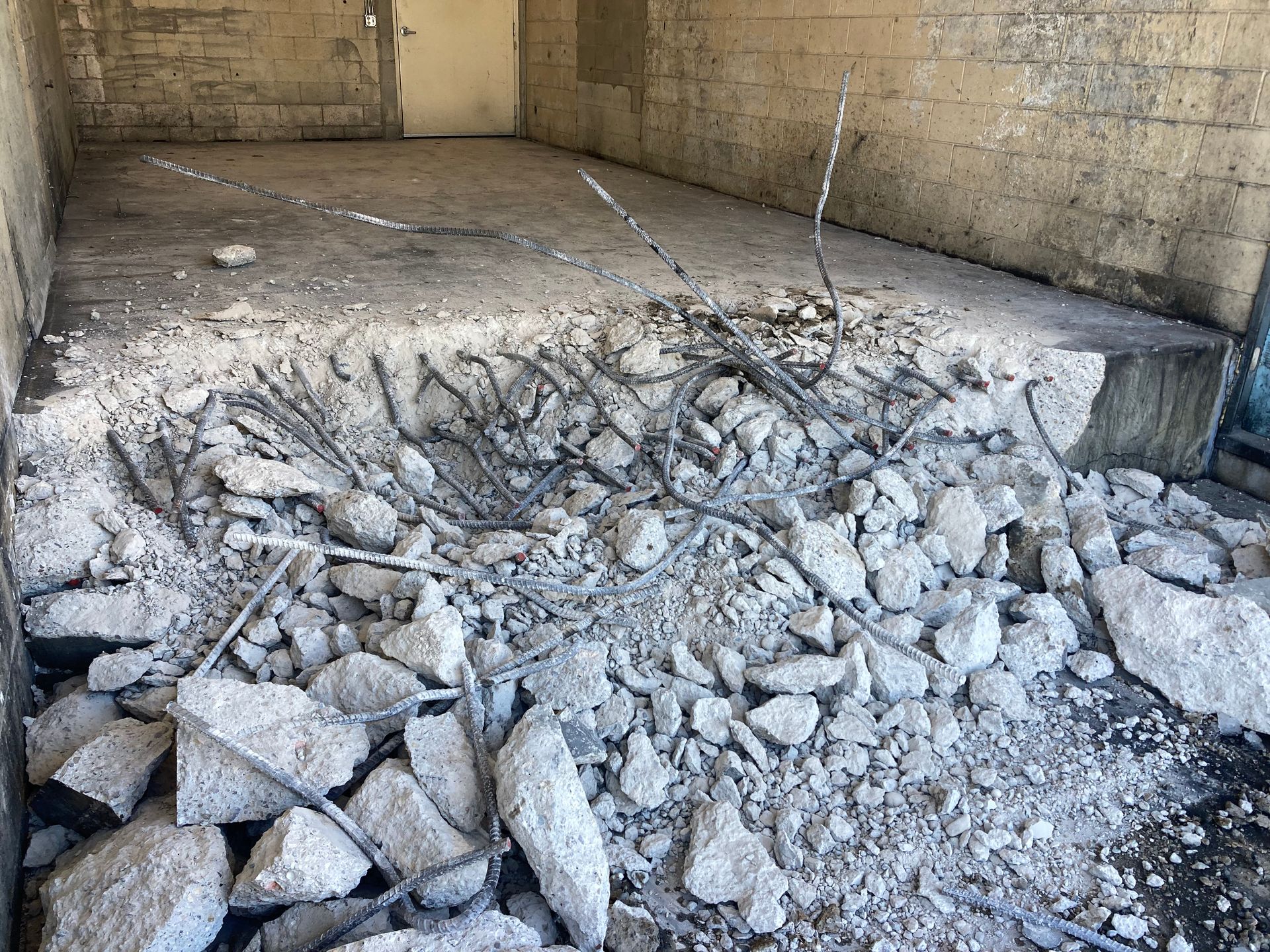 a pile of rocks is laying on the ground in a room