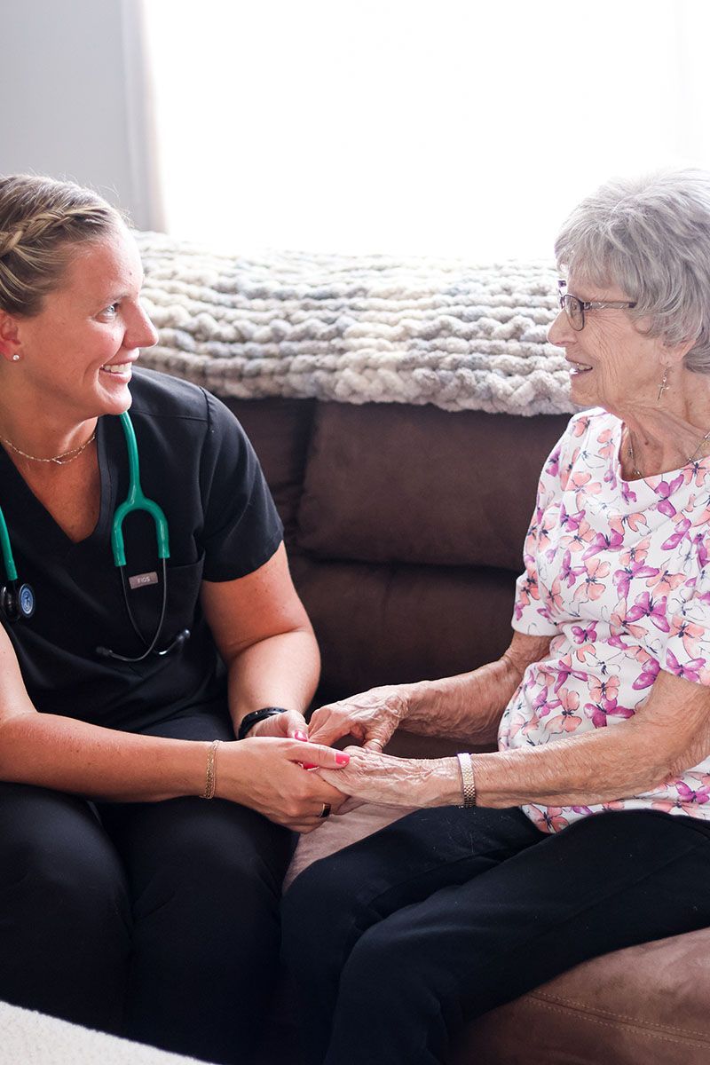 Caregiver holding hands 
