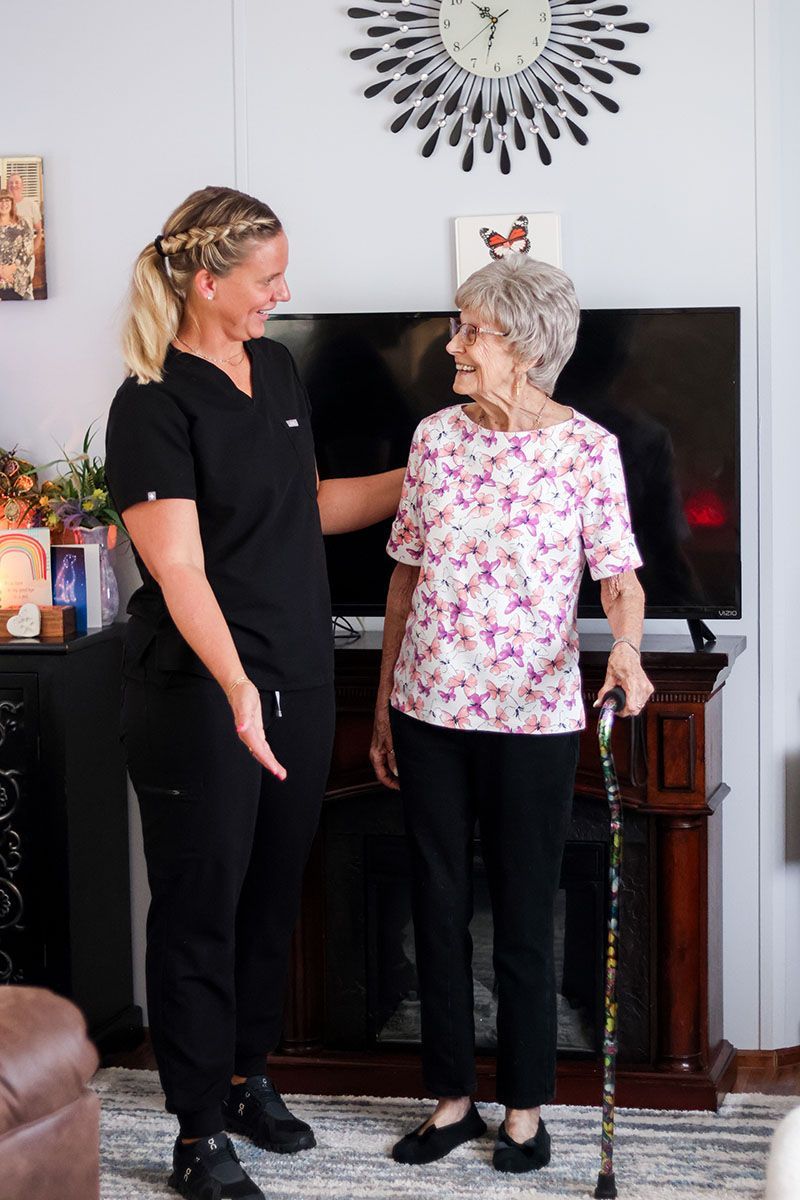 helping elder to walk
