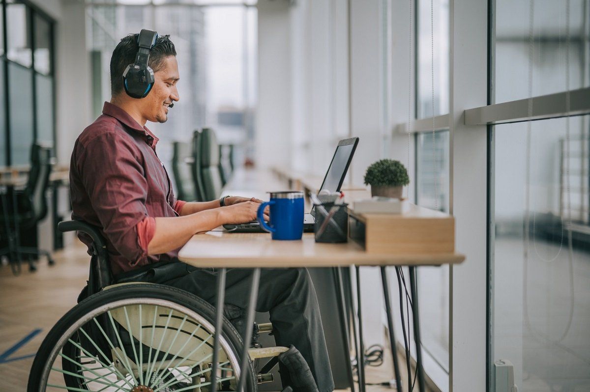 Smiling working man in wheelchair | Becker, MN | Current Accessibility Solutions Smiling working man in wheelchair | Becker, MN | Current Accessibility Solutions