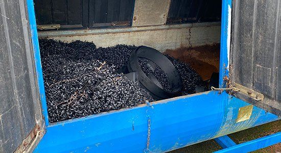 Karsten Lykkegaard with some of the waste bins at the factory