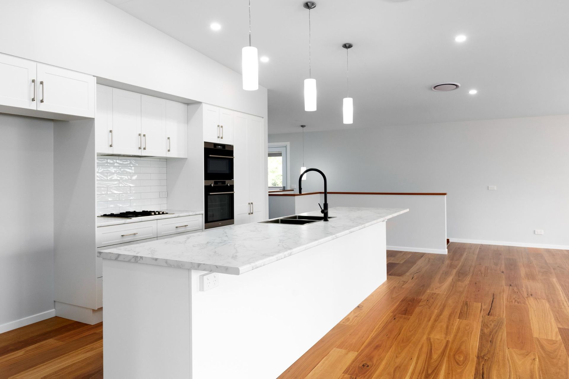 A House With A Wooden Deck And A Blue Sky In The Background — Nambucca Construction In Nambucca Heads, NSW