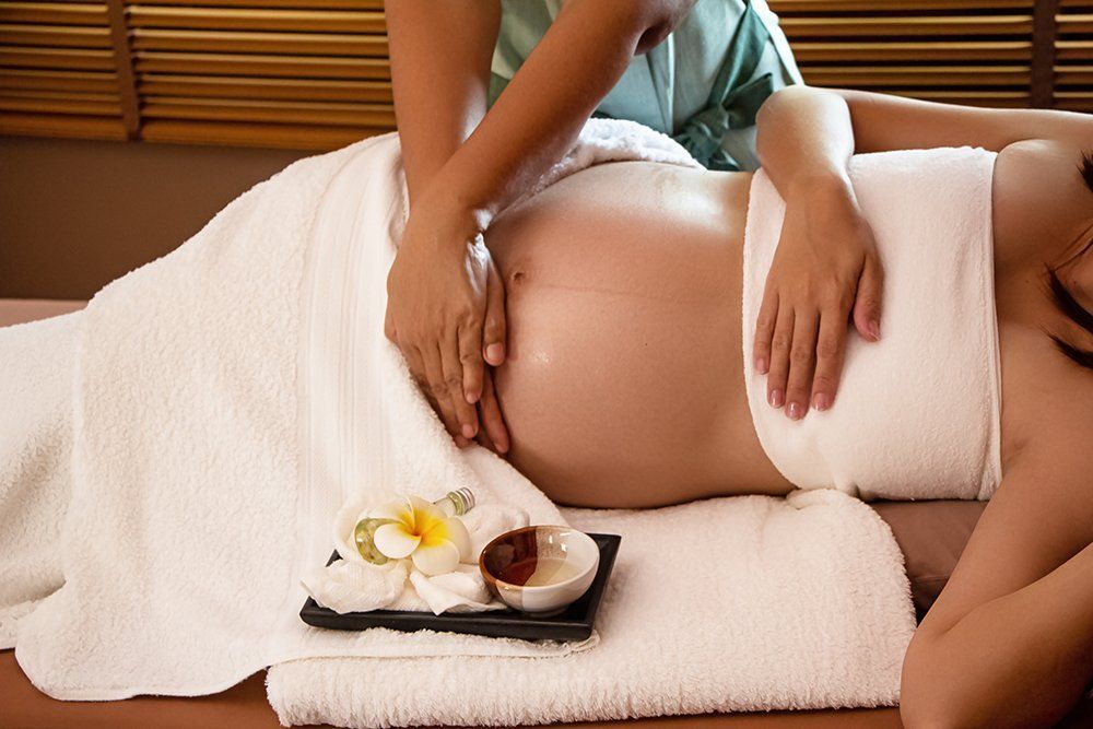 a pregnant woman getting a massage