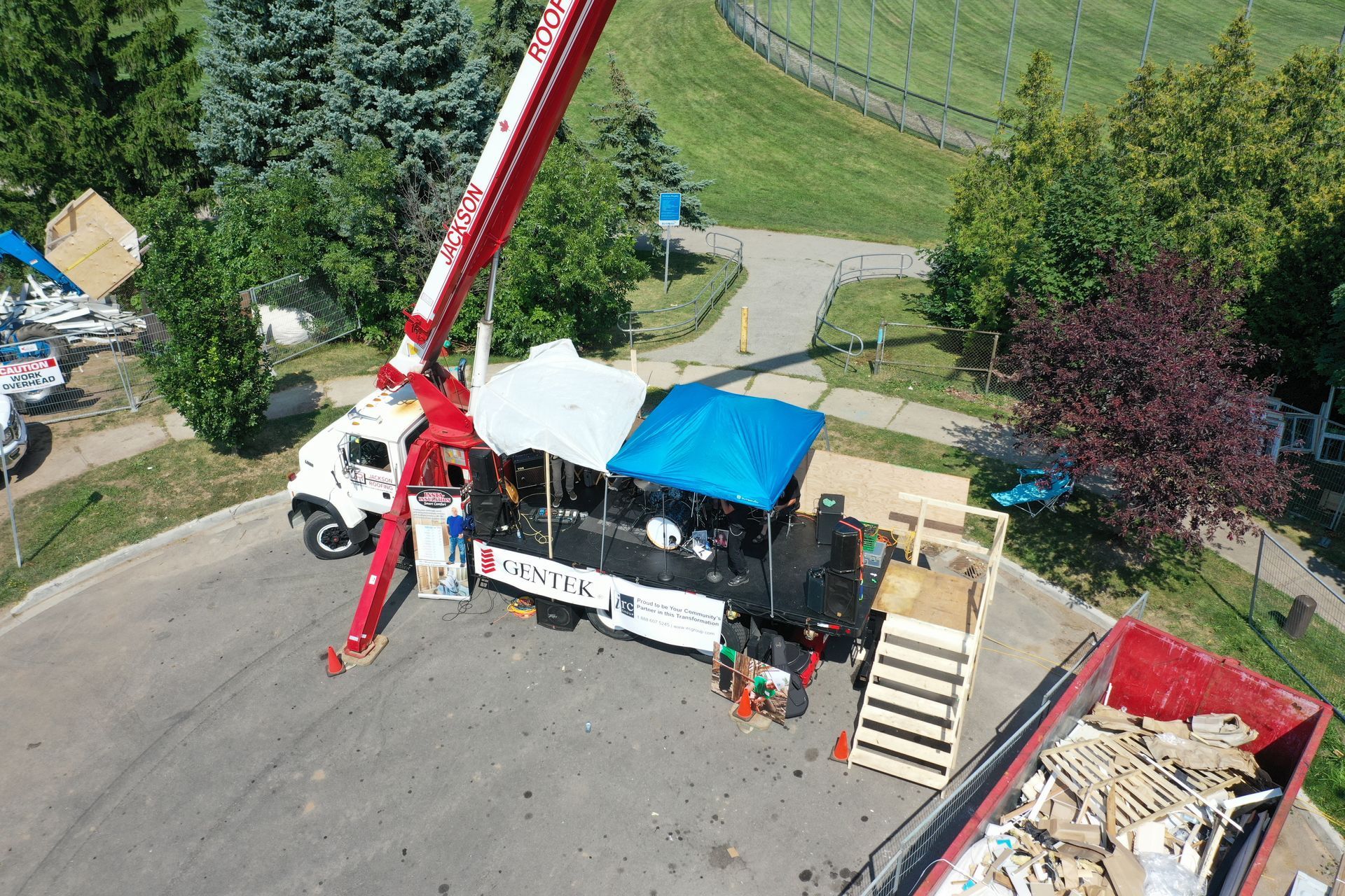 An aerial view of a truck with a crane attached to it.