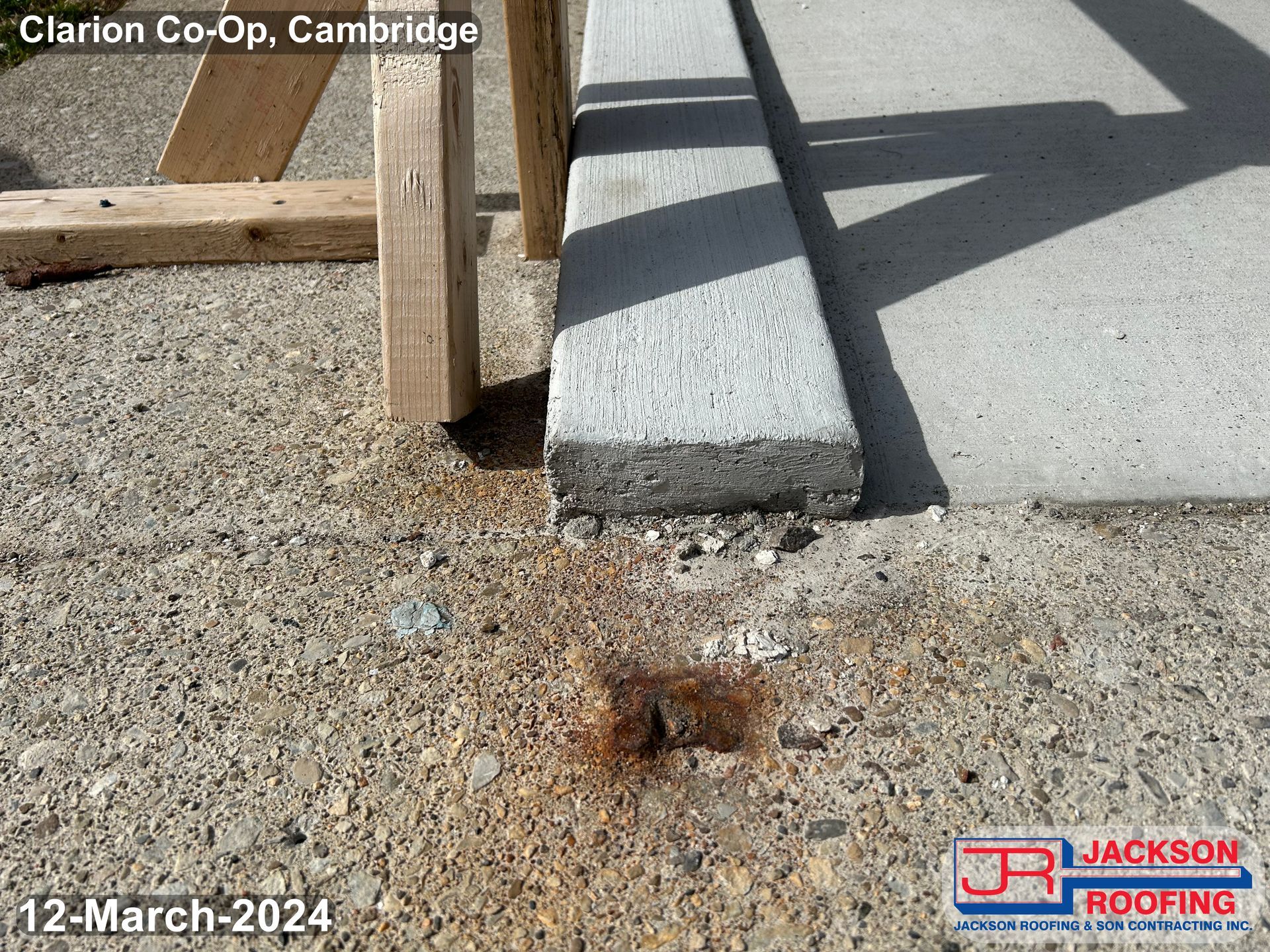 A picture of a concrete sidewalk taken on march 12th 2024