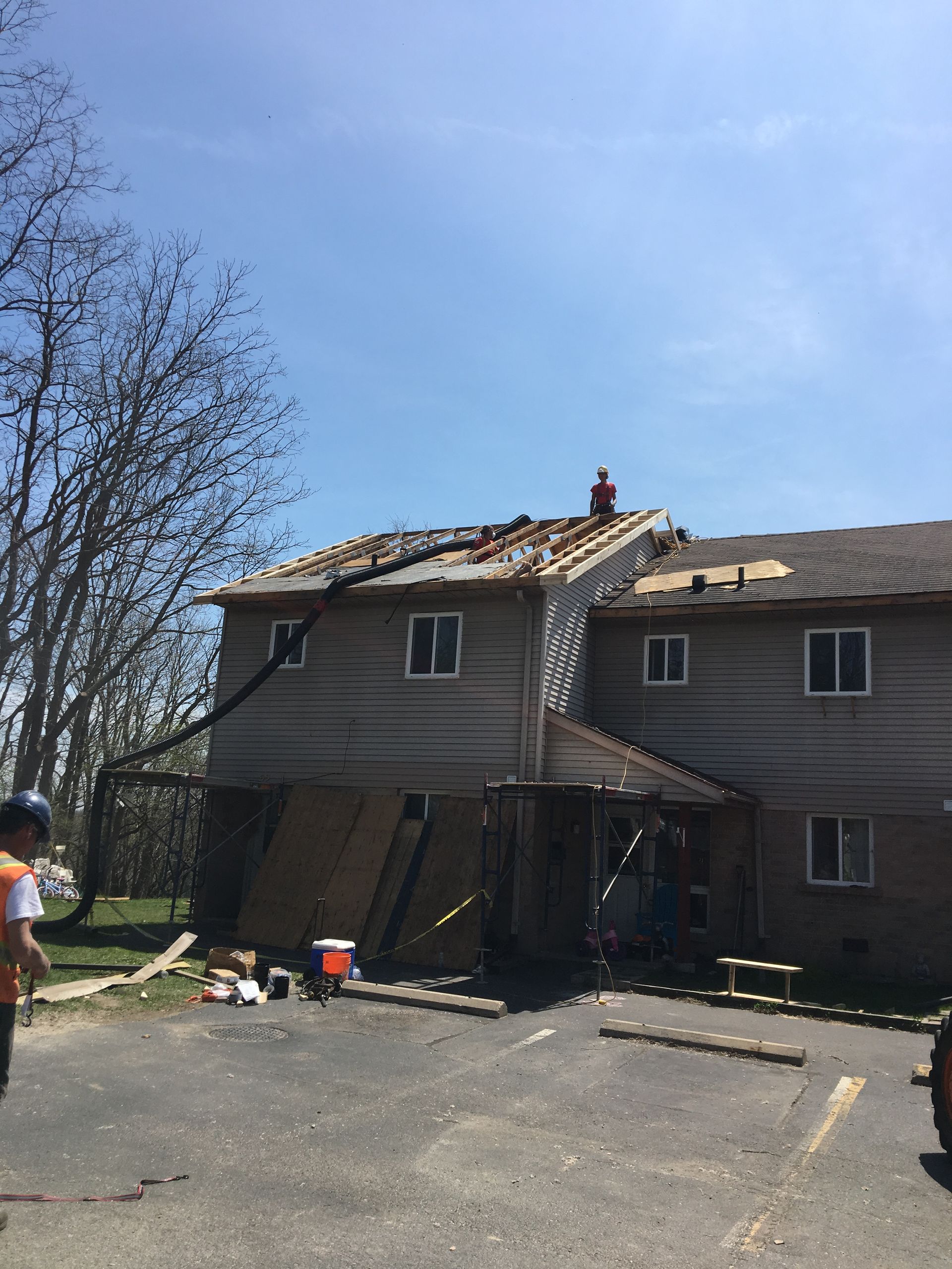 A house with a roof that is being repaired