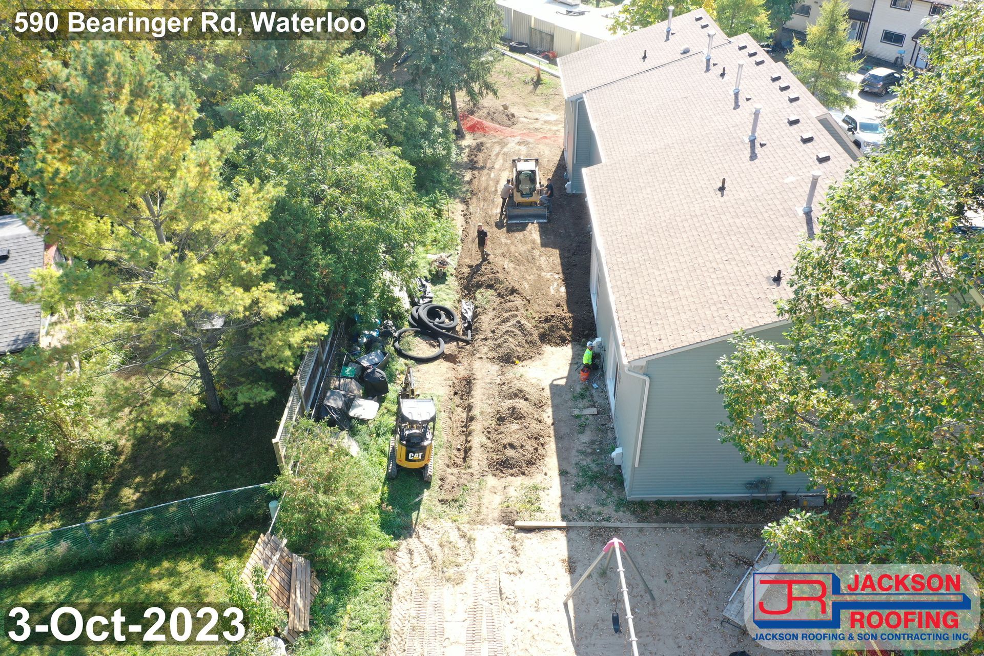 An aerial view of a house being remodeled by jackson roofing