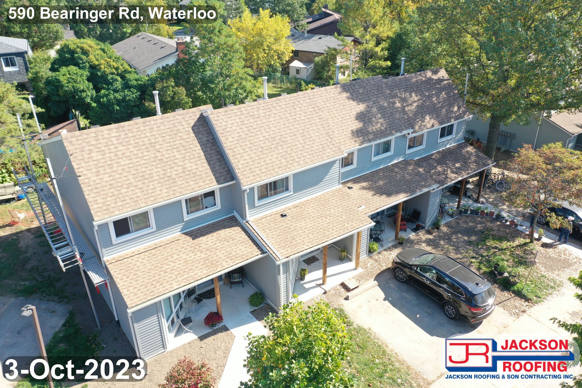 An aerial view of a house with a new roof.