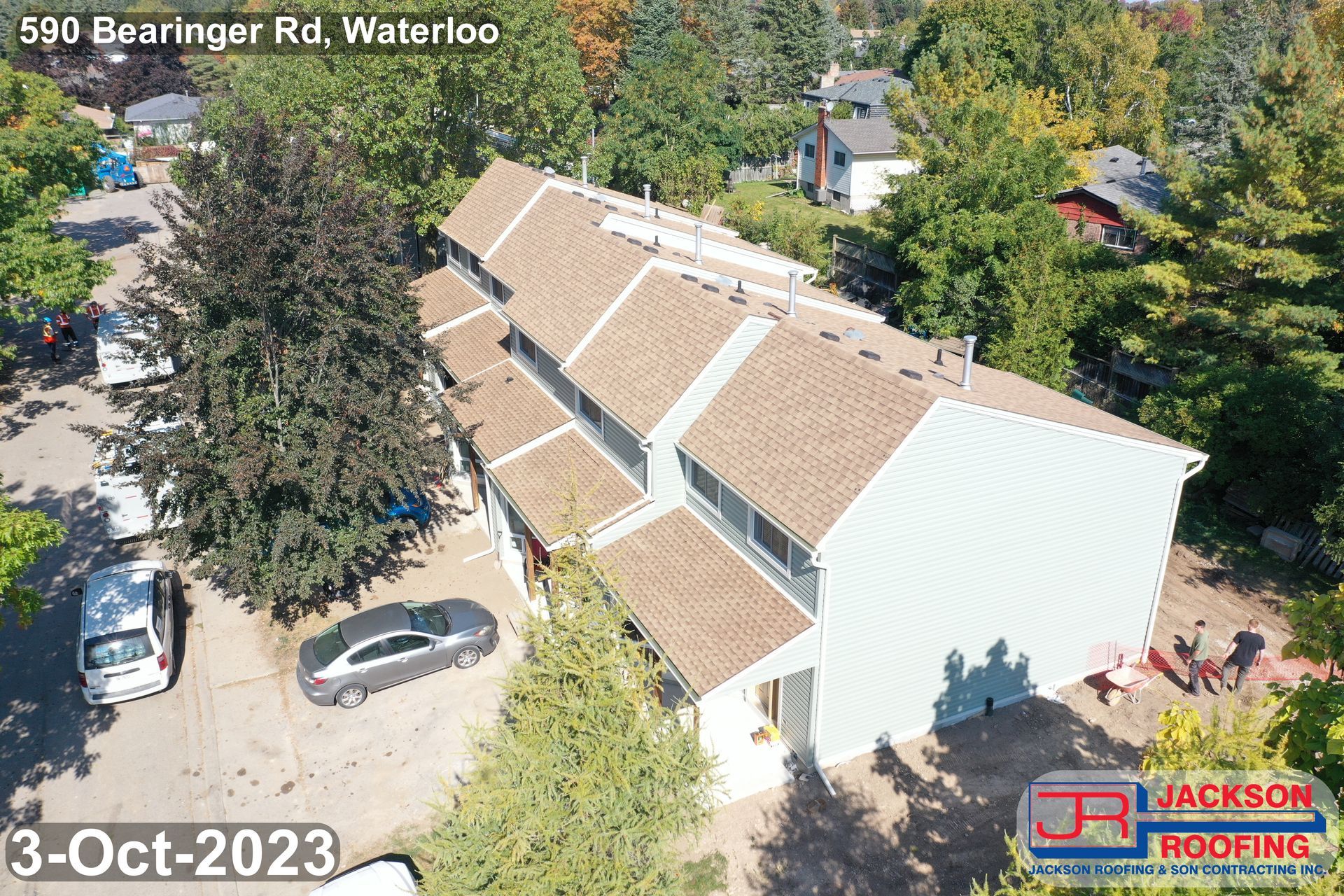 An aerial view of a house with a car parked in front of it.