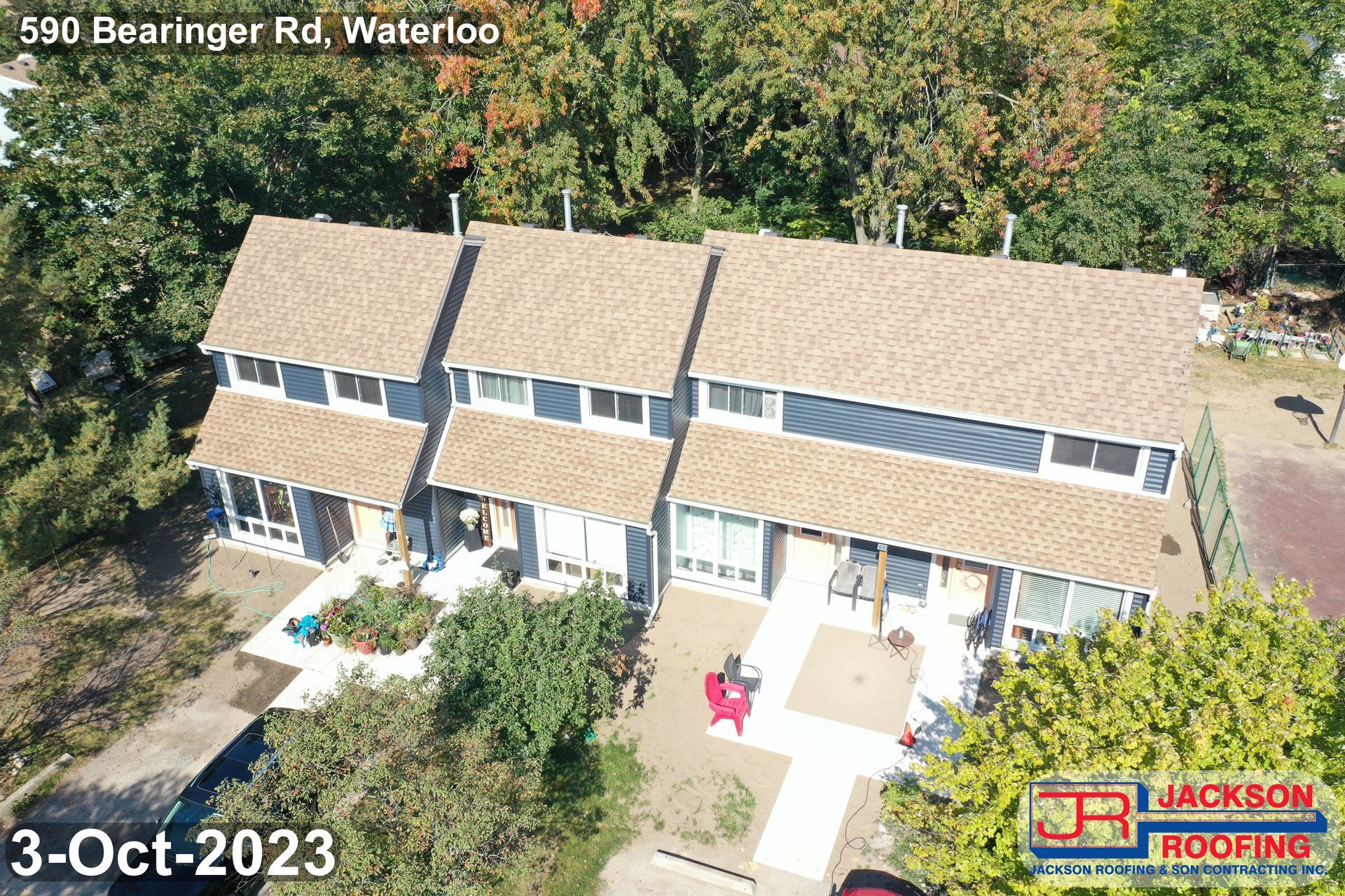 An aerial view of a row of houses with a brown roof.