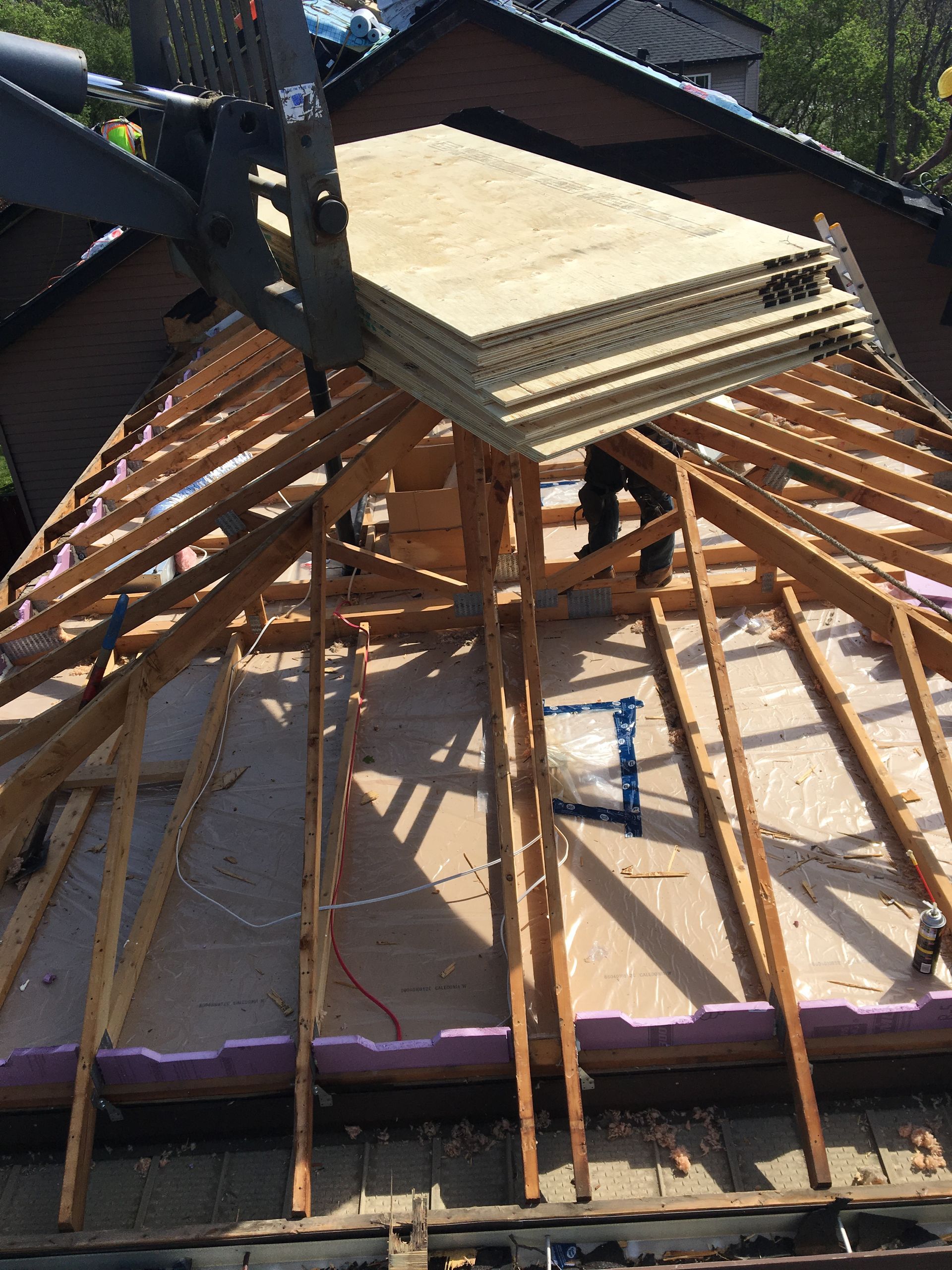 A stack of plywood is sitting on top of a wooden structure.