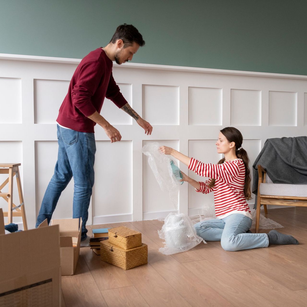 Couples cleaning new house