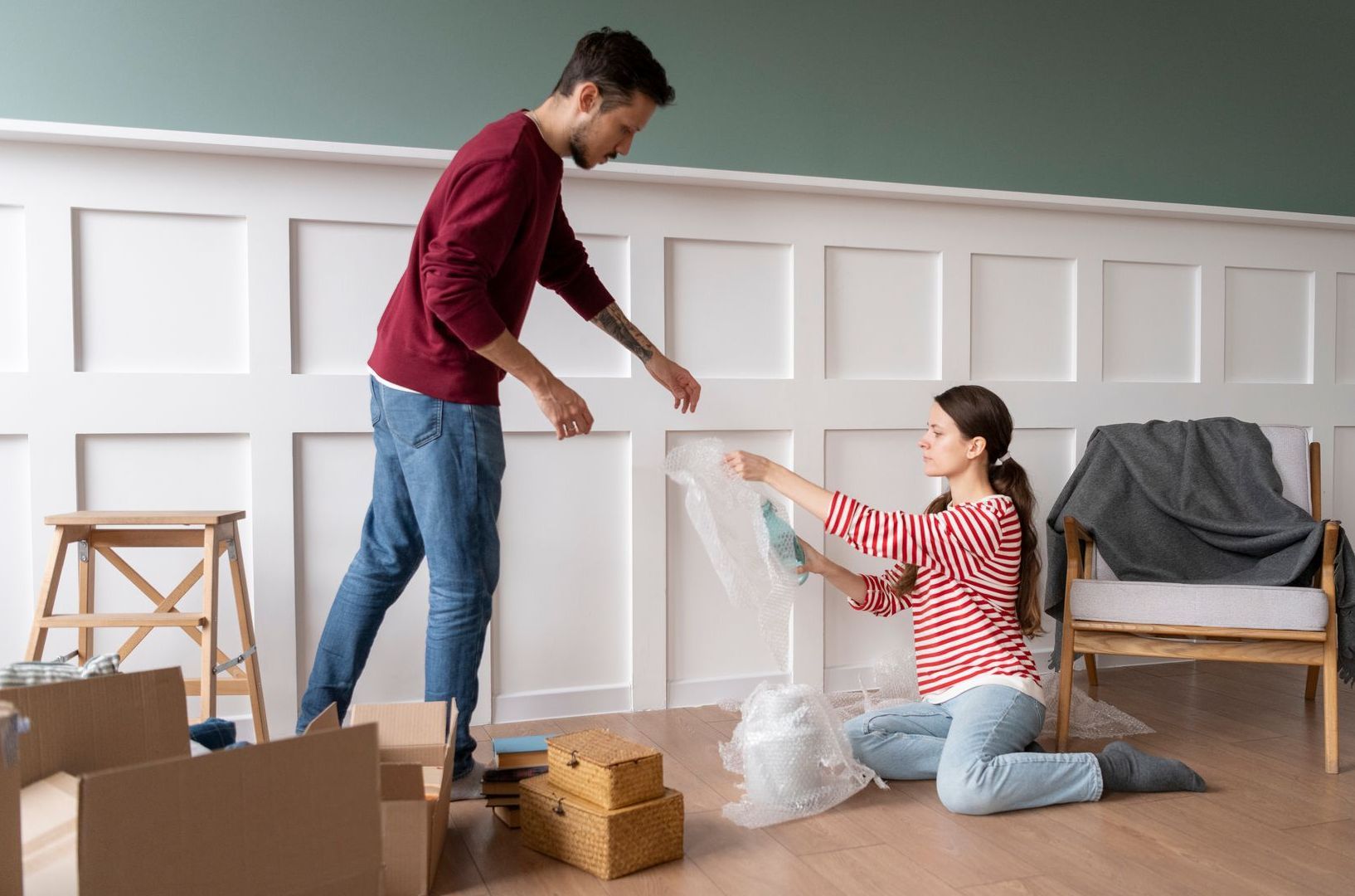 Couple cleaning the living room