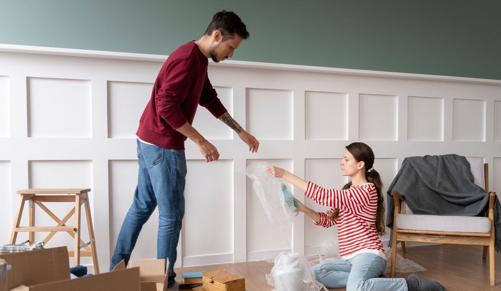 Couple cleaning the living room