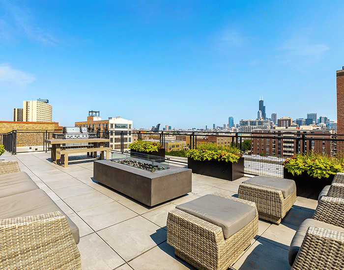 There is a fire pit on the roof of a building.