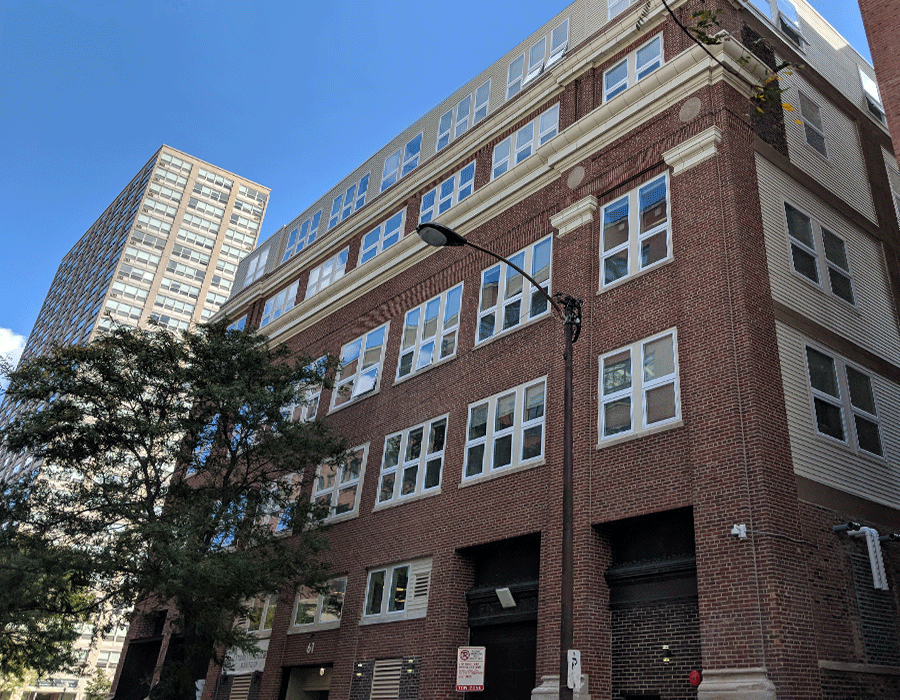 A large brick building with a lot of windows