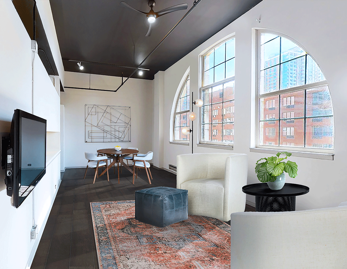 A living room with a couch , chair , table and television.