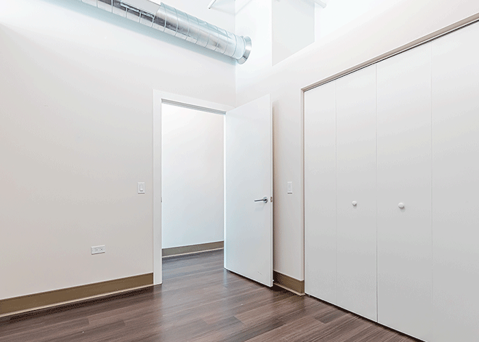 There is a closet in the middle of the room.