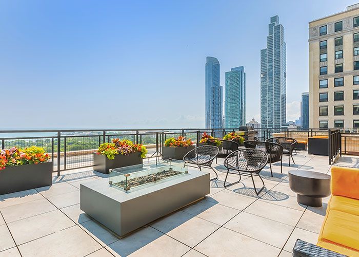 There is a fire pit on the roof of a building.