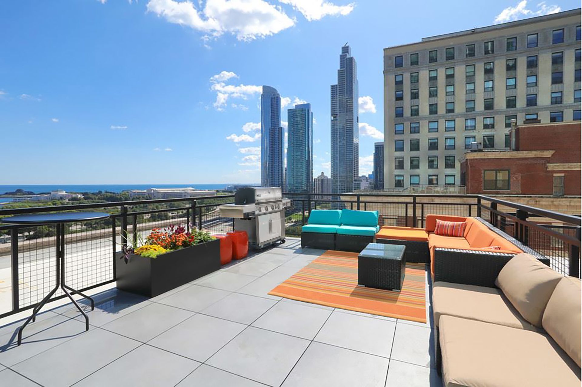 A rooftop patio with a view of the city