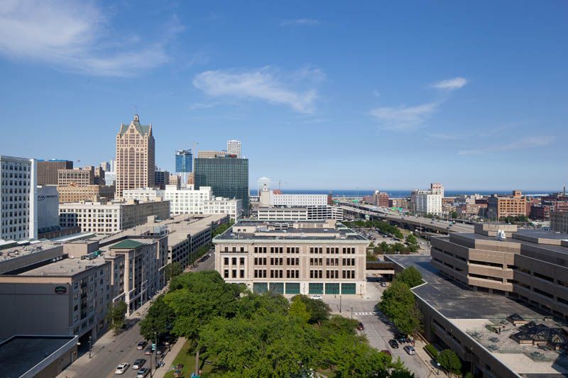 An aerial view of a city with lots of buildings and trees