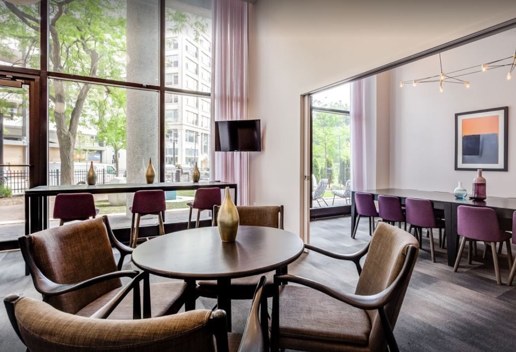 A room with a table and chairs in it