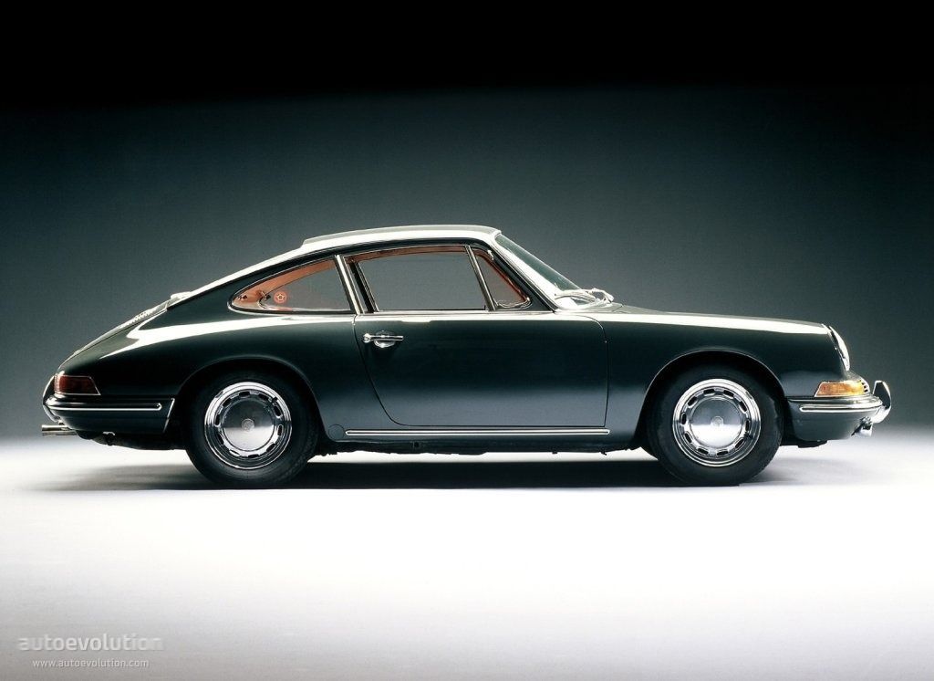 A black porsche is sitting on a white surface
