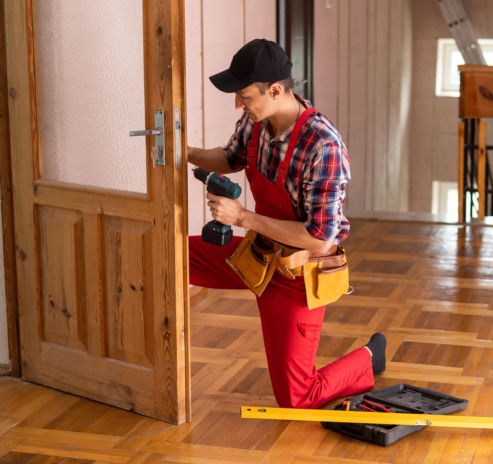 Professional Handyman Repairing Door