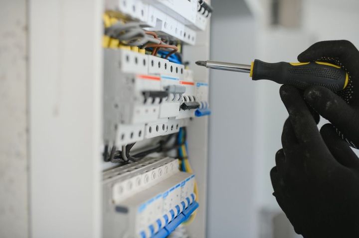 Electrician working on circuitry.
