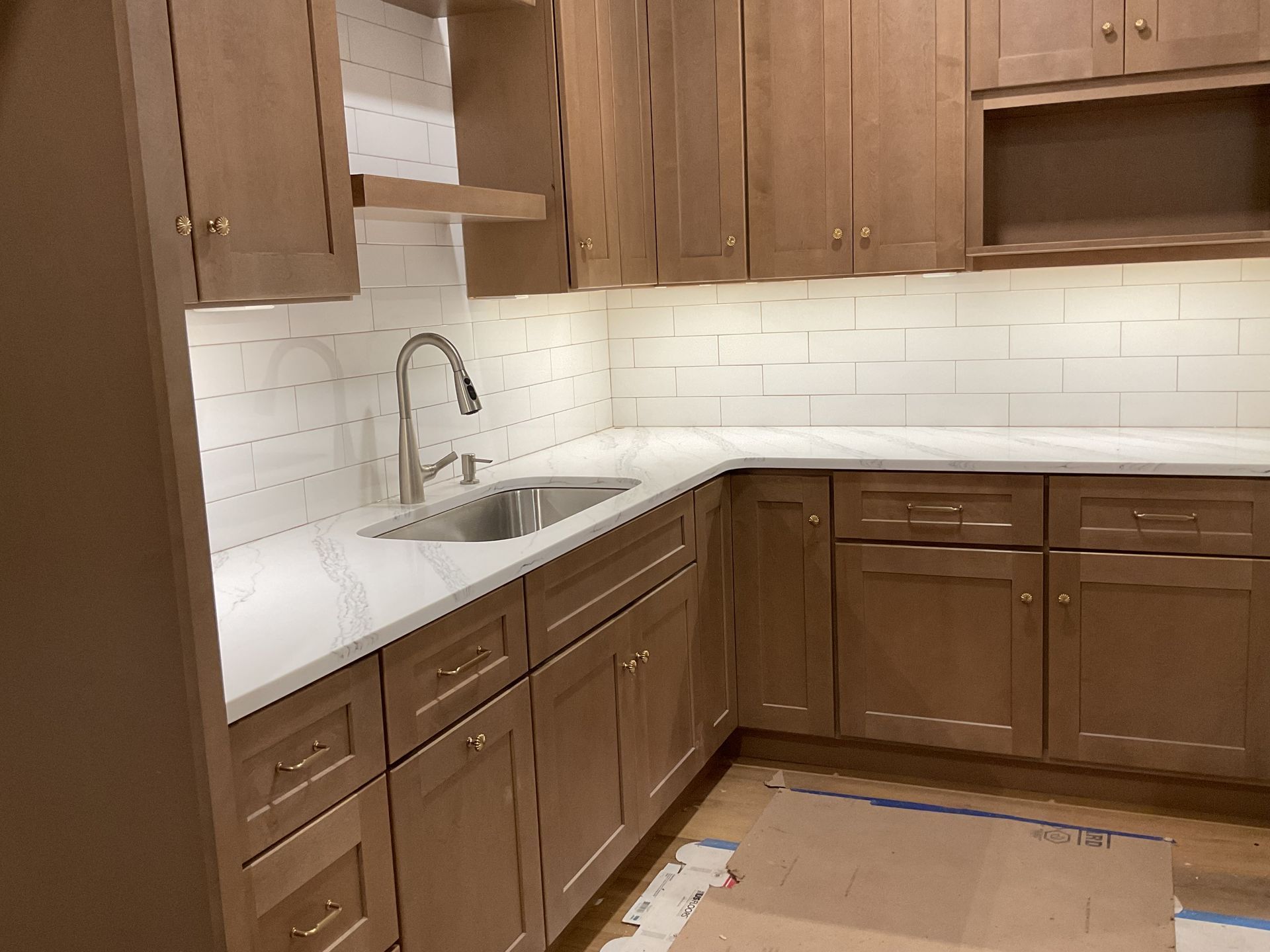 Lancaster County electrician installing undermount lighting during a kitchen remodel