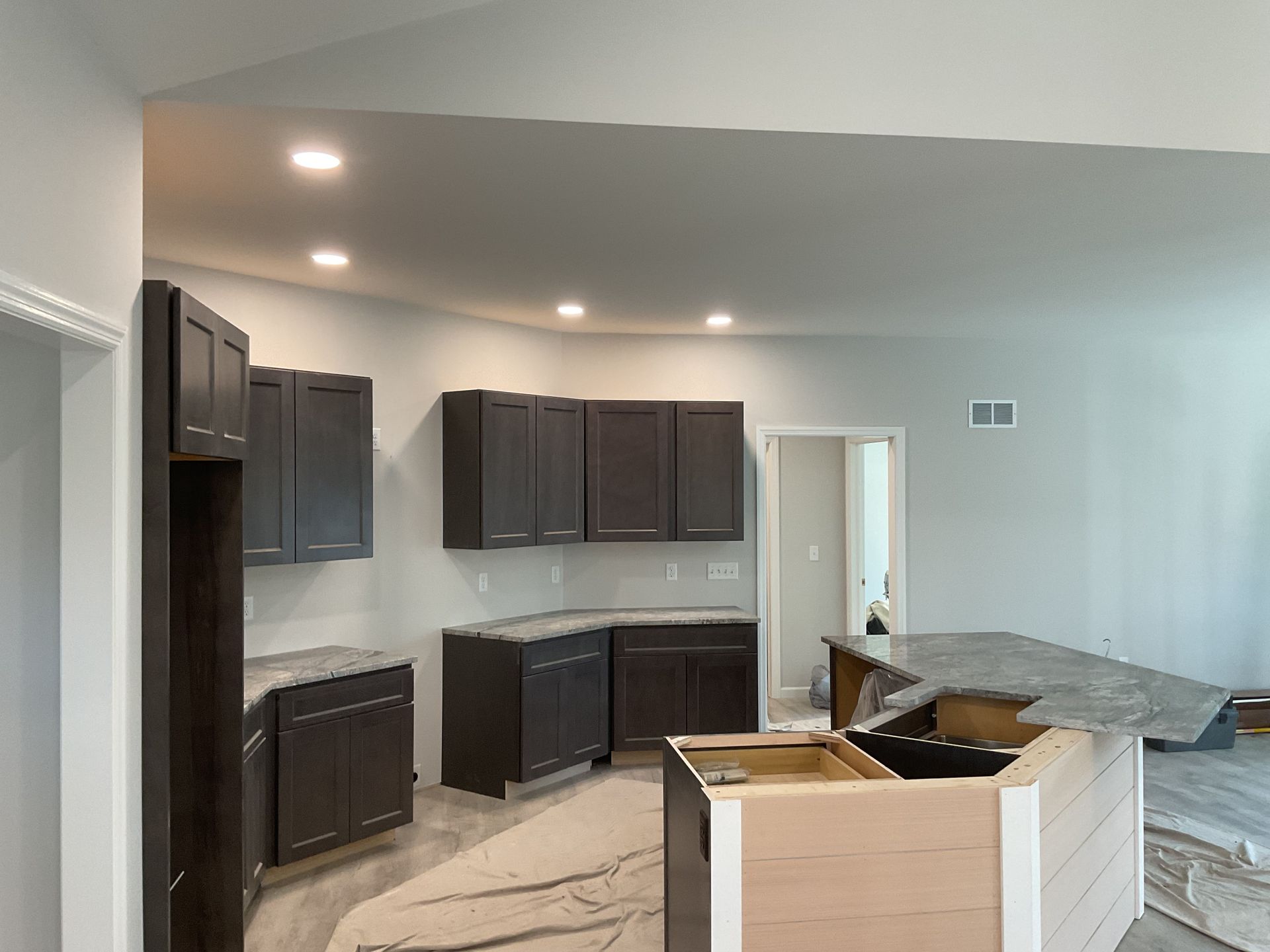 Lancaster County electrician installing recessed lighting during a kitchen remodel