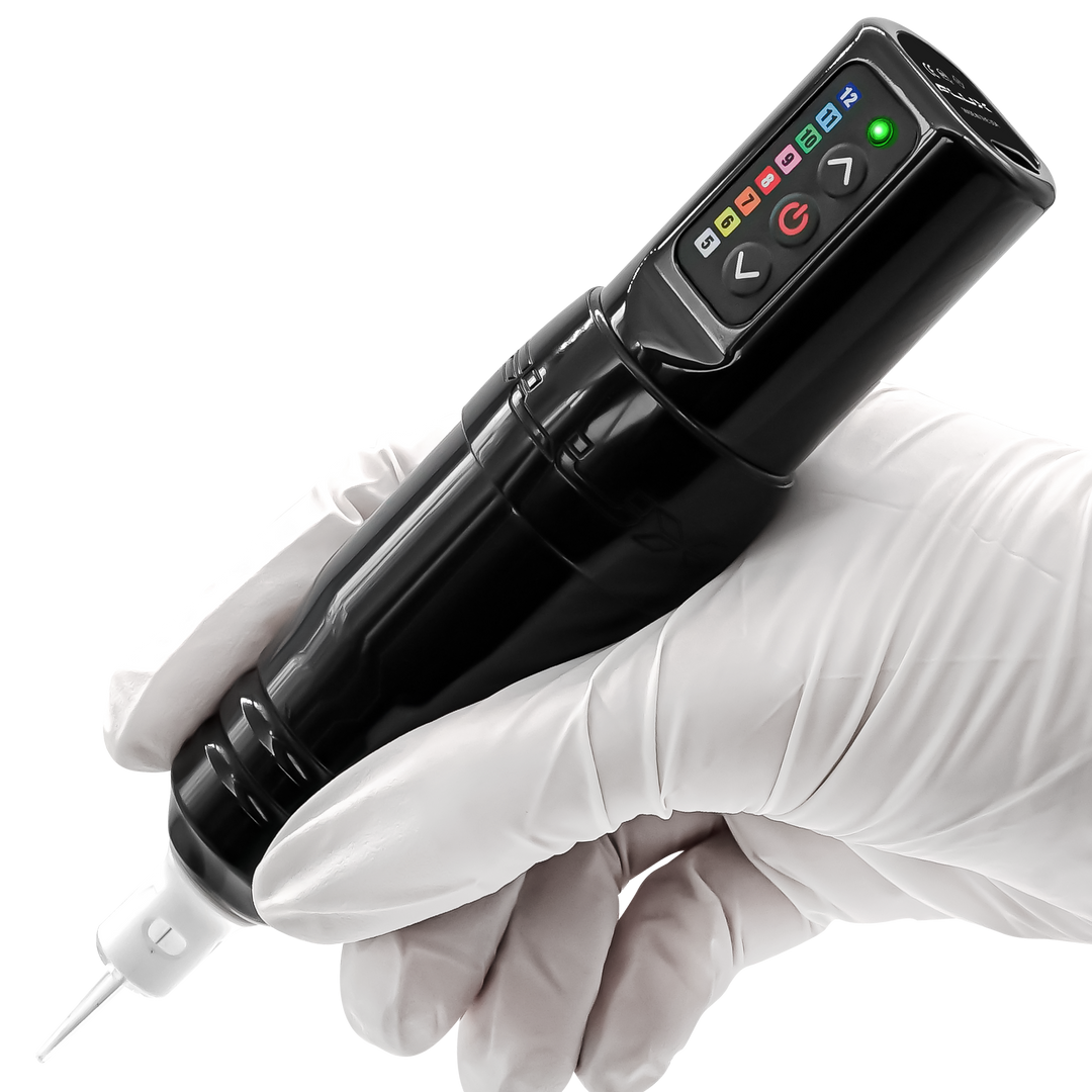 Black tattoo pen held in a gloved hand, displaying power level on the device.