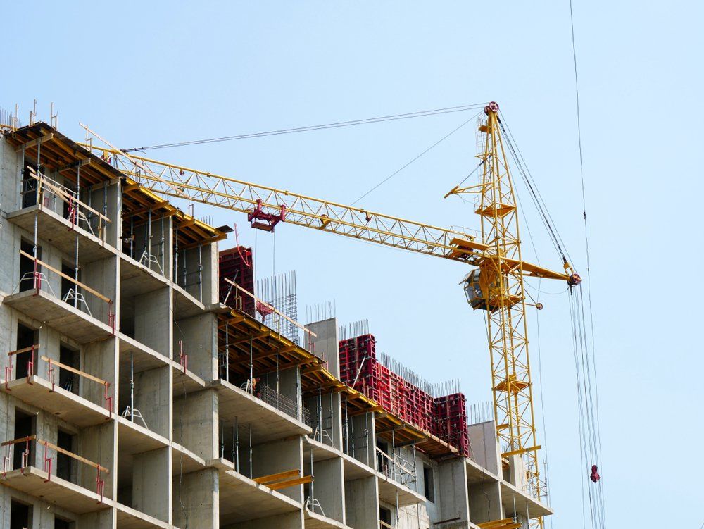 A crane constructing a large building